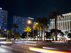 las vegas strip at night in front of casinos blurred lights