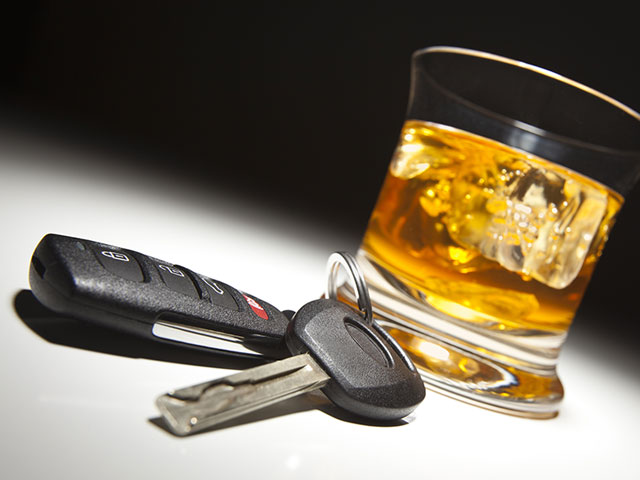 drinking and driving scotch glass with keys