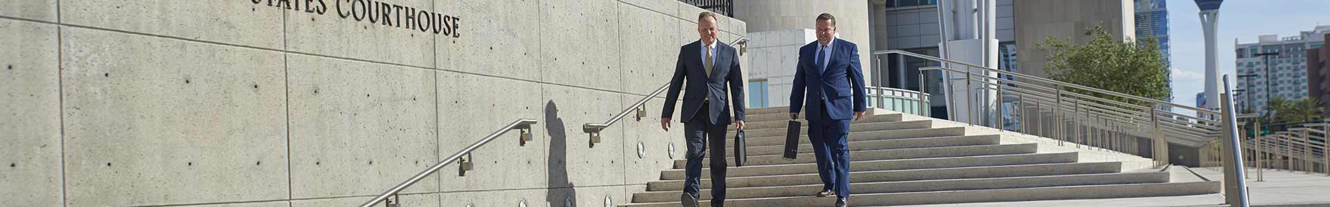 Criminal Defense Attorneys walking down courthouse steps in Las Vegas