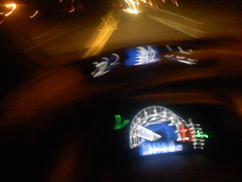 blurry image of person behind the wheel